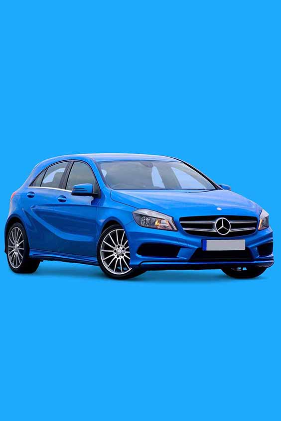 A blue Mercedes-Benz hatchback car is parked against a solid blue background. The car has a sleek, modern design, with five doors and silver alloy wheels. The front grille features the iconic Mercedes-Benz logo.